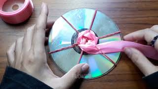 Wow  Amazing ribbon flower trick  how to make satin ribbon Rose with CD [upl. by Sulokcin]