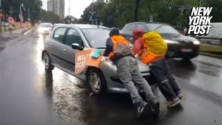 Irate drivers ram into climate protesters blocking traffic drag them hundreds of feet down highway [upl. by Sucramat528]