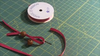 Needlepointerscom Quick Tip 19  Theading Bead with Ribbon [upl. by Nileuqcaj908]