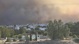 Wildfire approaching village on Rhodes island in Greece  AFP [upl. by Barcroft]