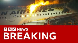 Japan Airlines plane in flames on the runway at Tokyos Haneda Airport BBC News [upl. by Ttelrats]