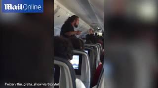 Passenger removed from plane by police after flight forced to divert [upl. by Aramenta129]