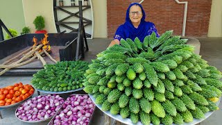 Karela Cooked In Our Traditional Style  Bitter Gourd Recipe  Village Cooking Recipe [upl. by Estele517]