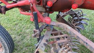 Lilliston rolling cultivators installed and working on a 1962 Farmall Cub [upl. by Yance]