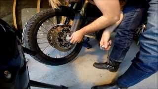 BMW F800GS Maintenance  Remove change tyre and install front wheel part 1 [upl. by Bland]