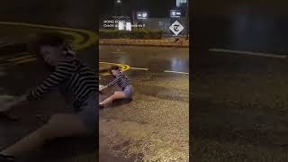 Woman violently thrown to ground by wind during Typhoon Saola in Hong Kong [upl. by Agnizn]