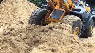 Construction of a water retention area with RC Wheelloader and Excavator [upl. by Erdnaek]