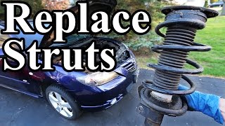 How to Replace Struts in your Car or Truck [upl. by Einahpit]