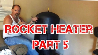 Rocket Heater Wood Stove Installation Part 5 The First Burn Indoors [upl. by Boeke811]