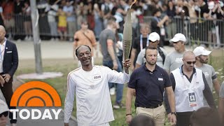 Watch Snoop Dogg carry the Olympic torch into Paris [upl. by Leahkim]