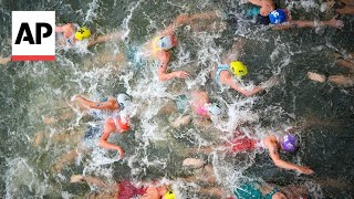 Triathlon kicks off on Day 5 at Paris Olympics  AP Top Photos [upl. by Kiraa]