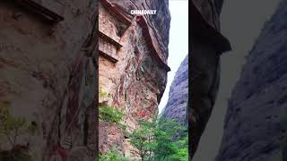 Lifelike giant Buddhas carved on cliff in Chinas Gansu [upl. by Yelrak]