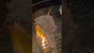 Searing off a delicious Ribeye Steak steak kettlegrill homecook bbq bonein mediumrare sear [upl. by Myrtie]