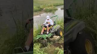 JOHN DEERE ZERO TURN MOWER SLIDING INTO A CREEK lawncare johndeere viralvideo mowing [upl. by Ssenav]