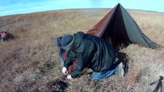 Tarp setup on the Plains allows for camp fire and blocks wind [upl. by Attikin]