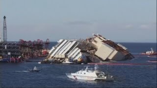 Costa Concordia time lapse Wrecked ship is pulled off rocks in Italy [upl. by Aerdied]