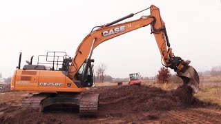 Case CX250C With An Engcon Tiltrotator Spreading Topsoil [upl. by Nassah655]