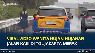 Viral Video Wanita Hujanhujanan Jalan Kaki di Tol JakartaMerak Diikuti Mobil Patroli [upl. by Drawyah463]