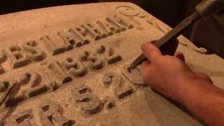 Carving a raised letter inscription into granite for a headstone [upl. by Ialokin]