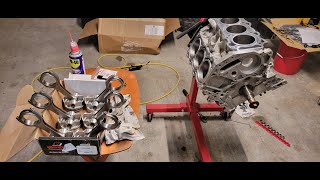 Forged VQ37VHR build part 18 rods and piston install [upl. by Ettenad]