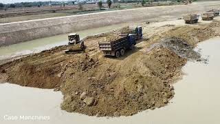 Part2 Busy teamwork Komatsu d60p pushing soil into water build foundation road with trucks mover [upl. by Socin]