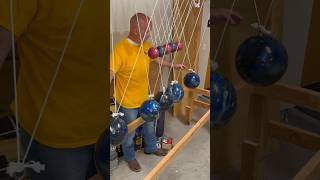 Newton’s Cradle made of bowling balls demonstrates laws of motion physics science [upl. by Talley]