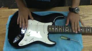 Adjusting a guitar tremolo system [upl. by Nauqram]