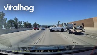 Narrowly Avoiding a Jackknifing Trailer on the Freeway  ViralHog [upl. by Rattray242]