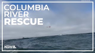 Men seen hanging onto capsized boat on Columbia River [upl. by Atterrol675]