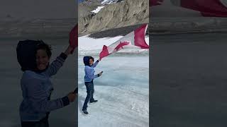 Athabasca glacier and Canadian flag off Columbia icefields Jasper [upl. by Rivkah541]