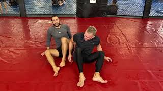 BJJ technique  Coach Zahabi and GSP show you one of their favorite moves from back control [upl. by Aihtak]