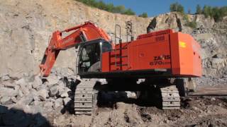 HITACHI ZX670LCH5 loading a KOMATSU HD325 in a quarry [upl. by Yeltrab905]