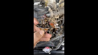 How to replace a thermostat on a Hilux [upl. by Jennifer315]