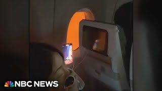 Video shows passengers stuck on burning plane in Japan [upl. by Anaidiriv]