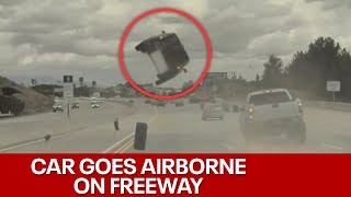 Tire pops off truck flips car on California freeway [upl. by Hultin]