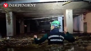 Spain floods Rescuers wade through chesthigh water as death toll exceeds 200 [upl. by Doralyn832]