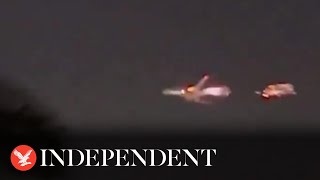 Watch moment Atlas Air Boeing 747 erupts into flames midair over Miami [upl. by Aierdna905]