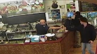 Watch Store Clerk Completely Ignore An Armed Robber To Help Customers [upl. by Airotkiv]