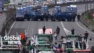 Farmer protests Armoured police vehicles block highway as tractors push to reach Paris [upl. by Ludvig654]