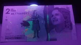 Chromophores 2000 Colombian Pesos Banknote 2018 Uncirculated under ultraviolet light [upl. by Wandis]