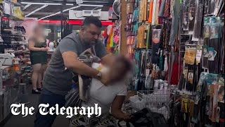 Peckham shop owner seen choking woman accused of stealing [upl. by Annaerda198]